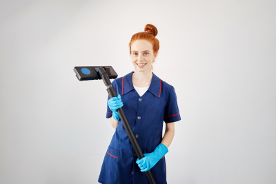 Caucasian female housekeeper with red hair bun