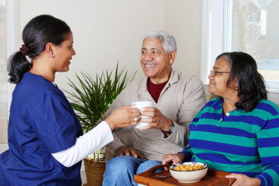 Home health care worker and an elderly couple